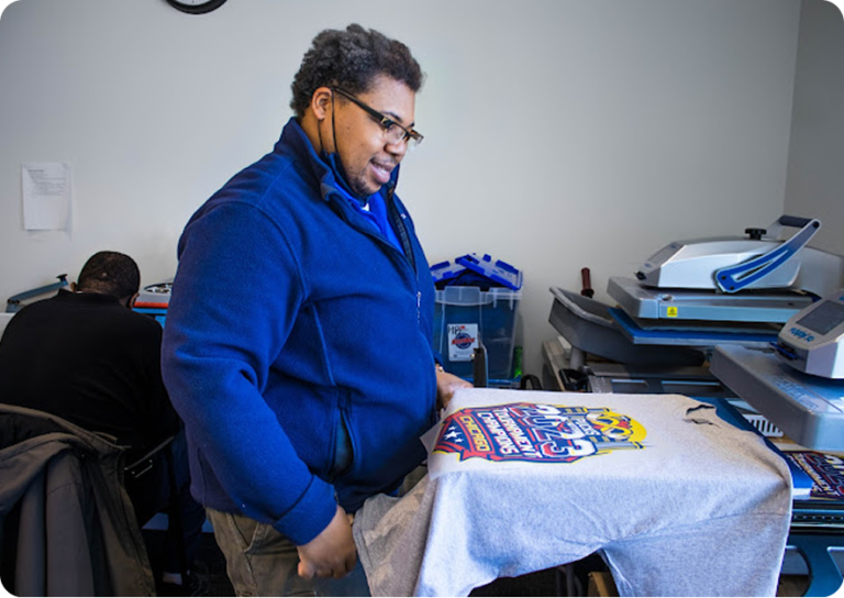 HB Threads employee creating custom printed shirt